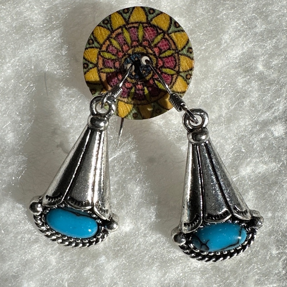 Silver turquoise color drop earrings.
